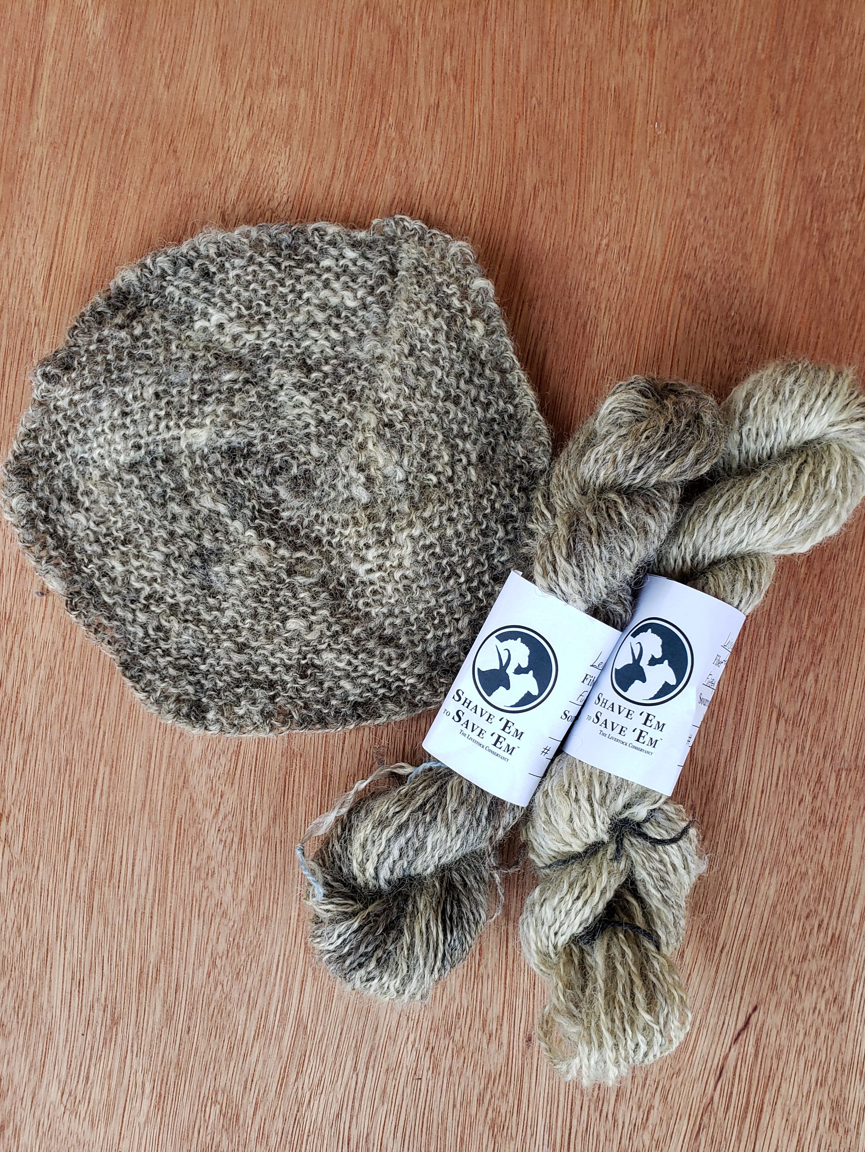 (L-R) An knitted hexagon from carded longwool; two skeins of Leicester Longwool yarn.